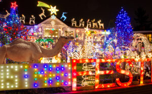 A house with over-the-top holiday display and lights.