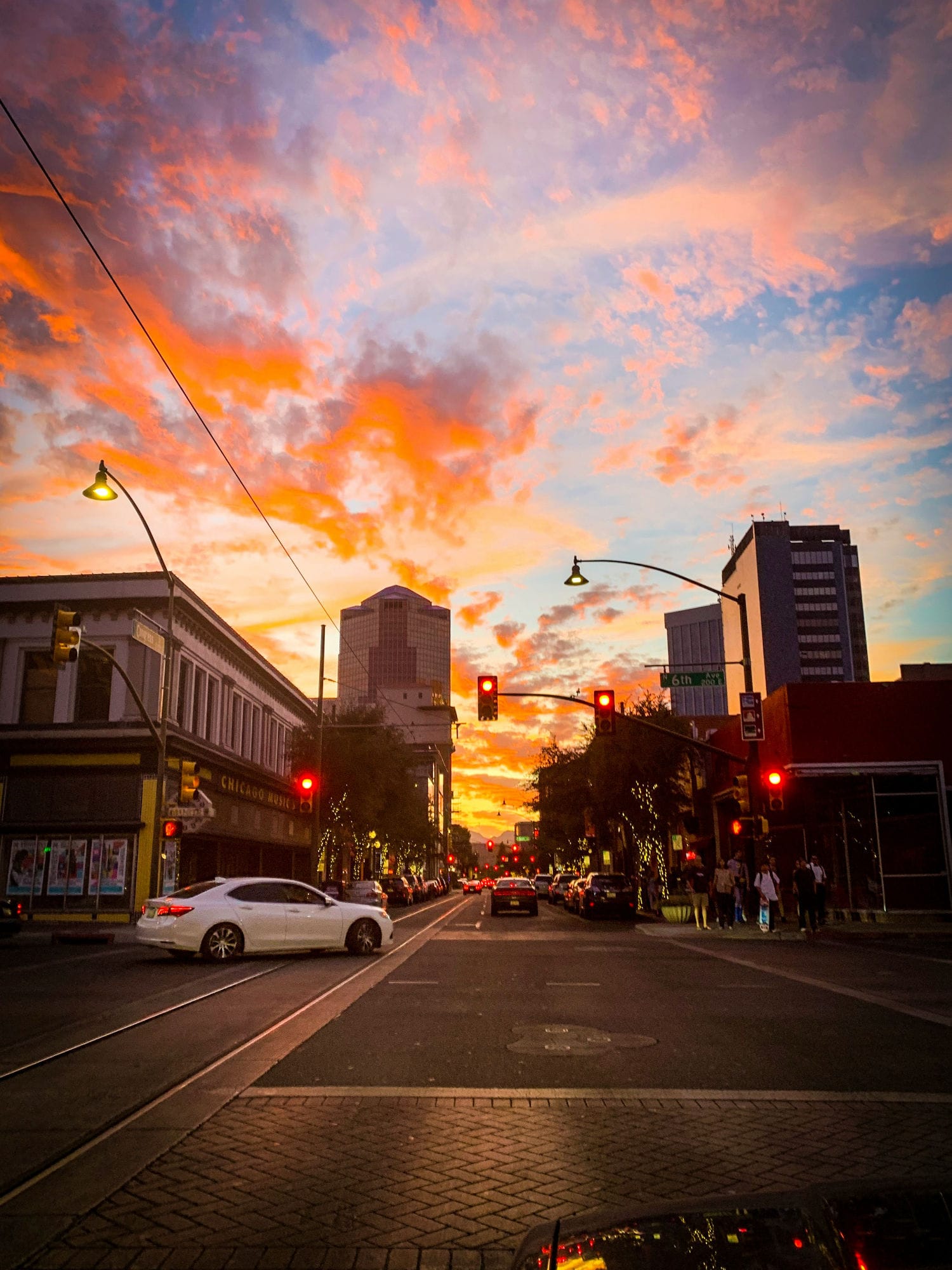 A street in downtown Tucson, Arizona with busy parking.